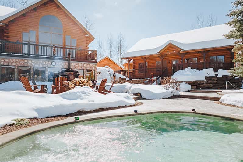 From Montreal: Natur'Eau Spa Day Trip with Admission Ticket - Outdoor pools, waterfall, and fireplace
