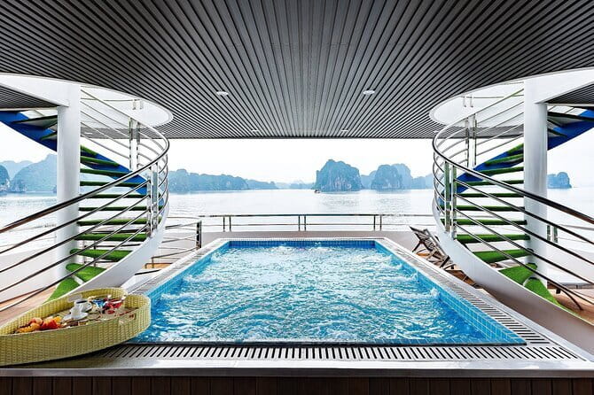 Halong Bay Day Tour Luxury Cruise With Jacuzzi and Buffet Lunch - Sunset fruit, cake, and the ride back