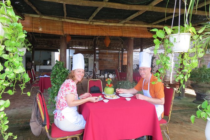 Hoian Cooking Class And Foot Massage Private Tour - Picking herbs and vegetables at Tra Que