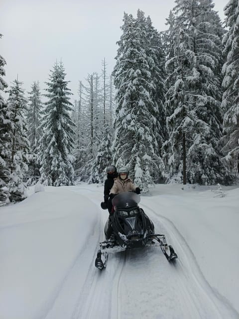 Krakow: Snowmobile & Thermal Baths Zakopane Full Day Tour - Snowmobiles through the snowy mountains