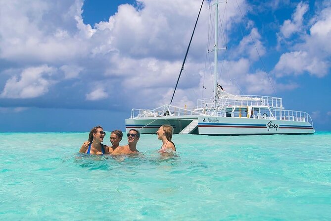 Luxury Cozumel Catamaran: Snorkel, Beach Club & Relaxation - Setting sail from Cozumel’s ferry terminal
