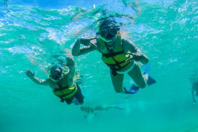 Luxury Cozumel Catamaran: Snorkel, Beach Club & Relaxation - Burgers, fries, and an open drink plan