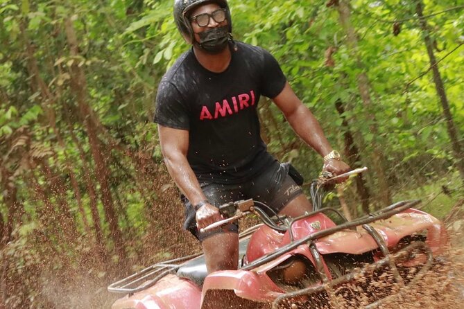 Montego Bay ATV Ride & Bamboo Rafting With Limestone Foot Massage - A bamboo raft on the Great River
