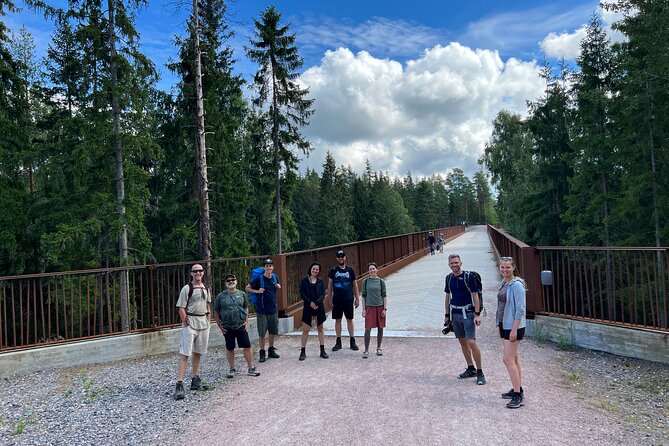 National Park Hike & Finnish Smoke Sauna Experience with Campfire Lunch - A campfire meal beside the lake