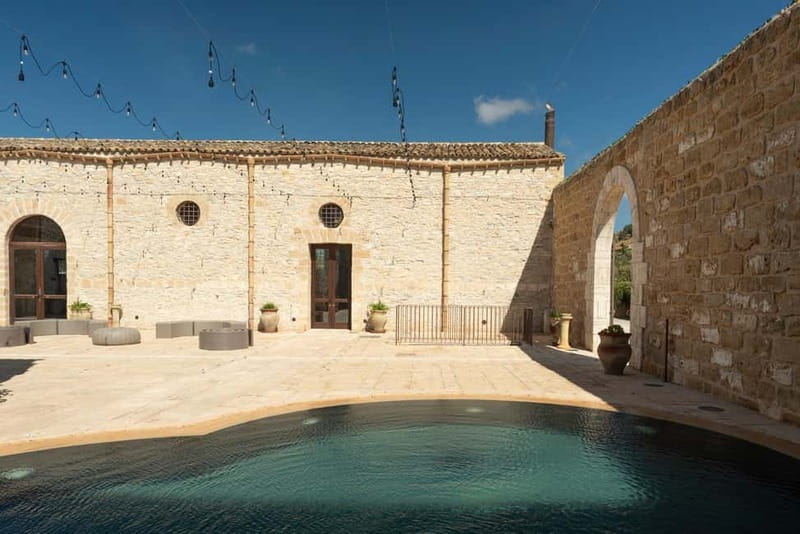 Nature and relaxation by the pool at Baglio Passofondo Estates - Why the baglio setting matters