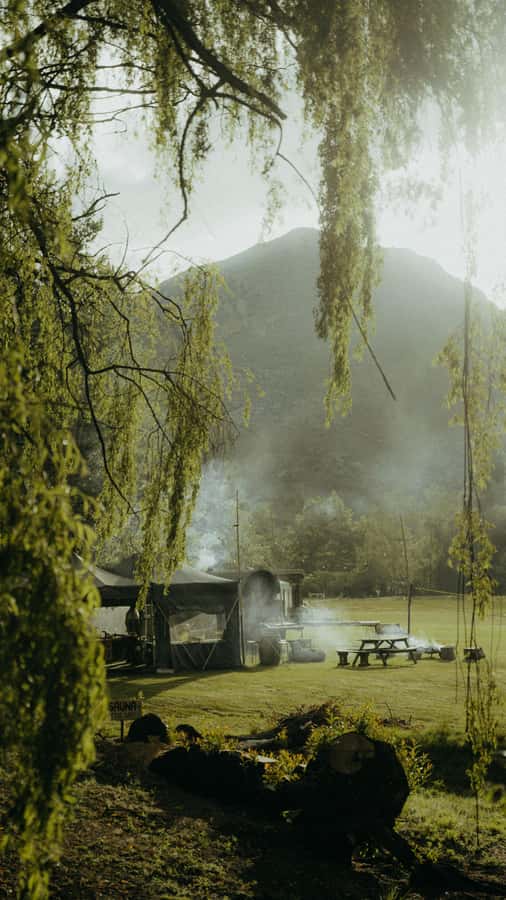 Queenstown: Riverside Sauna and Cold Plunge Experience - Fire pit, herbal tea, and Queenstown views