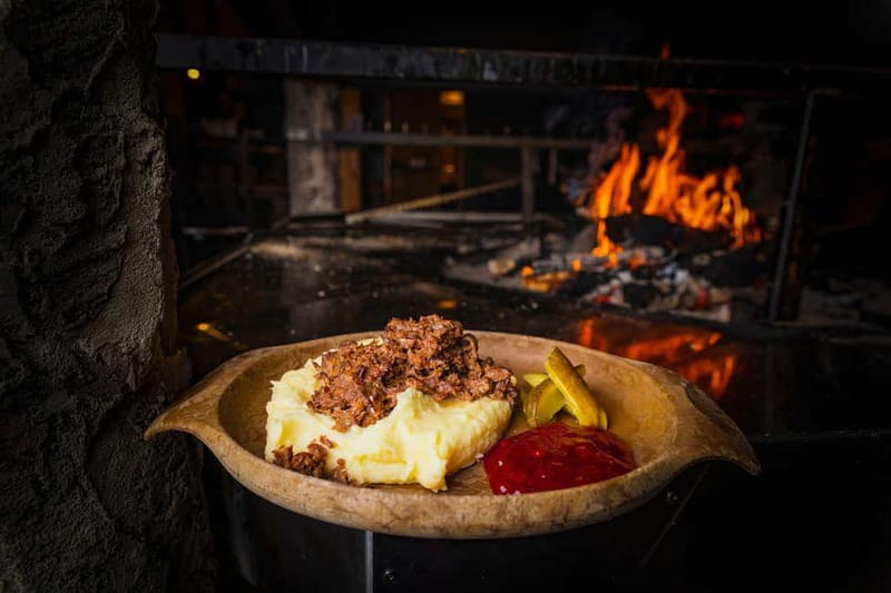 Rovaniemi: Snow Sauna Experience, Jacuzzi and Dinner in Kota - Dinner by the fire in the Kota restaurant