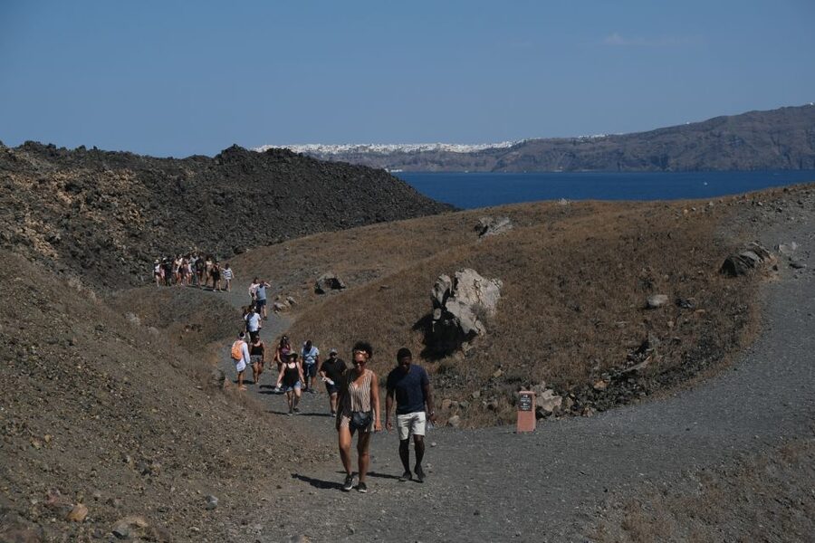 Santorini: Volcano and Hot Springs Sunset Dinner Cruise - Swimming at Palia Kameni’s sulfur springs