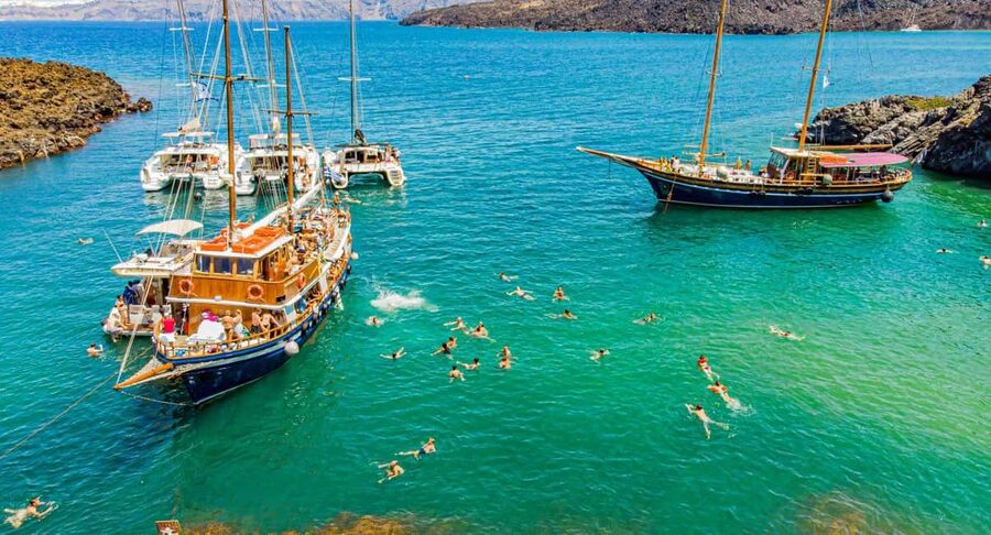 Santorini Volcano, Hot Springs Adventure - Nea Kameni: black rock and a crater walk